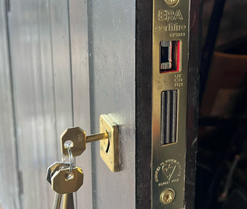 Wood door fitted with new ERA high security lock