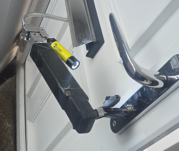 Locksmith gaining access to a home after resident locked themselves out