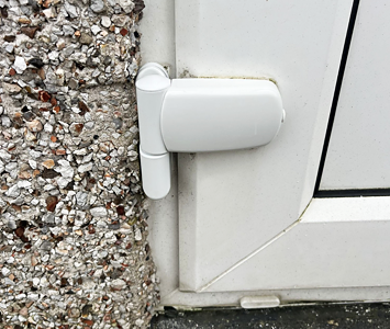 uPVC door with replacement hinge