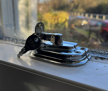 Homeowner improving security with upgraded window locks